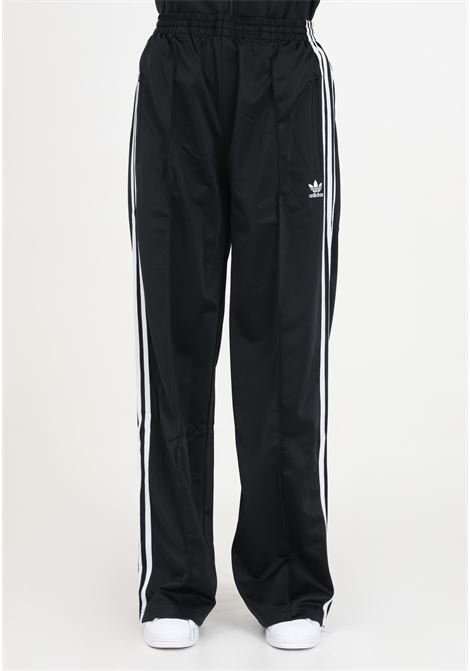 Firebird Loose black women's joggers with vertical stripes ADIDAS ORIGINALS | IT7404.